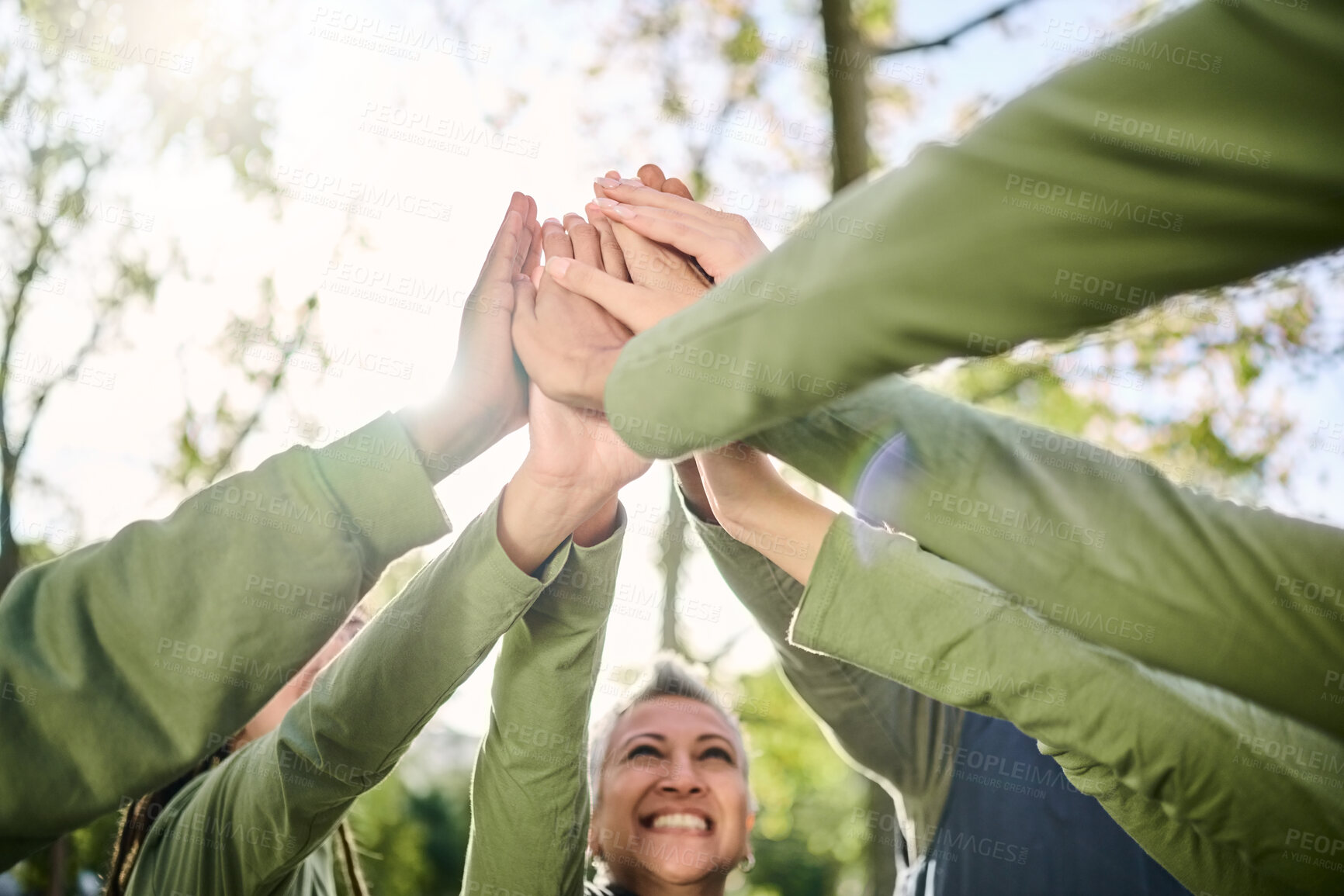 Buy stock photo High five, outdoor and hands from team building at a wellness retreat with community and support. Volunteer, happiness and smile of support group excited with collaboration, trust and solidarity 