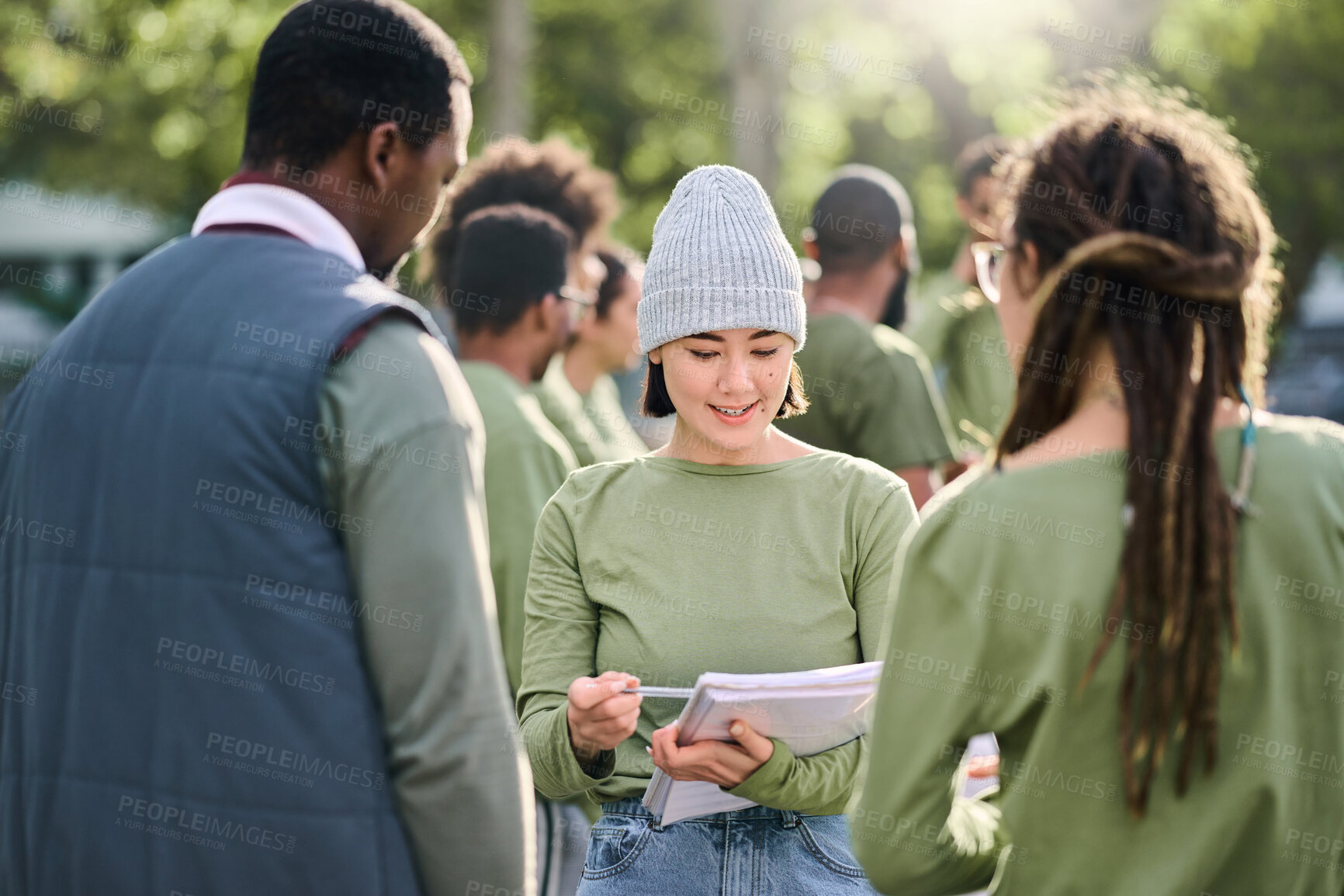 Buy stock photo Volunteering, team and people in nature for community service, support and planning of leadership goals. Ngo, charity person with schedule or task management in forest, park or eco friendly project