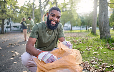 Buy stock photo Black man, volunteer portrait and plastic bag for community park cleanup, recycling or cleaning. Ngo person outdoor in nature to recycle, earth day or happy about a clean from pollution enviroment