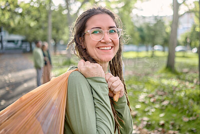 Buy stock photo Plastic bag, park and happy woman for eco friendly cleaning on earth day, community service or volunteering support. Recycle, trash or garbage of ngo person in portrait for nature or forest pollution