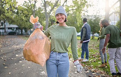 Buy stock photo Plastic bag, park and happy woman in cleaning portrait for earth day, community service or volunteering support. Recycle, trash or garbage goals of ngo person helping in nature or forest pollution