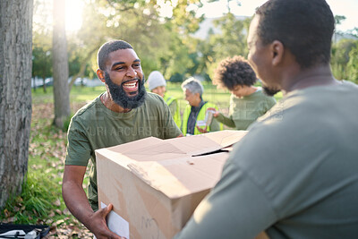 Buy stock photo Community service, black man and giving box in park of donation, volunteering or social responsibility. Happy guy, NGO workers and helping with package outdoor of charity, support or society outreach