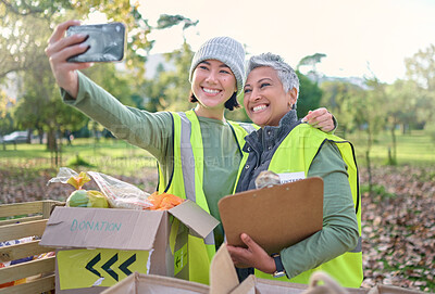 Buy stock photo Selfie, volunteer and donation with a woman charity or relief worker friends taking a picture together. Teamwork, community and photograph with female people carrying a box for humanitarian aid