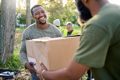Buy stock photo Black man, volunteering and giving box in park of donation, community service or social responsibility. Happy guy, NGO worker and helping with package outdoor for charity, support or society outreach