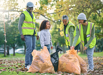 Buy stock photo Child with volunteer group for cleaning park with garbage bag for a clean environment. Men, women and child team helping and learning eco friendly lifestyle, community service and recycling in nature