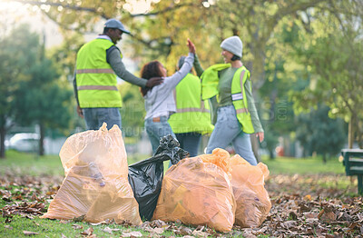 Buy stock photo Volunteer, child and people high five while cleaning park with garbage bag for a clean environment. Group or team help with trash for eco friendly lifestyle, community service and recycling in nature