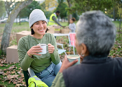 Buy stock photo Volunteer, coffee and break by women relax after community service, cleanup and project in park, happy and bond. Charity, environment and recycling friends resting in a forest with tea and a talk