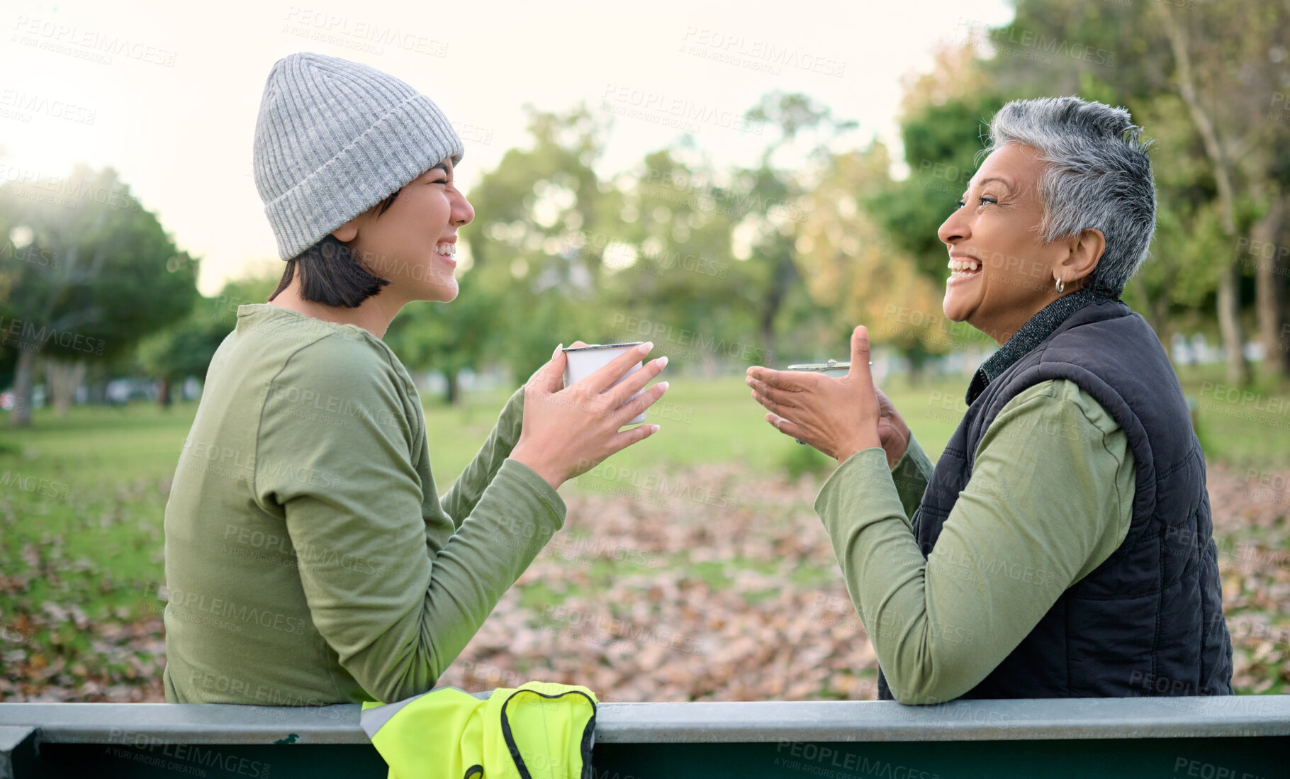 Buy stock photo Women, coffee and volunteer relax after community, cleanup and project in a park, happy and bonding. Charity, environment and recycling friends resting in a forest with tea, cheerful and content