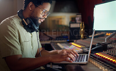 Buy stock photo Black man, thinking and laptop for music recording, sound engineering or song composition in studio. Producer, DJ and musician on technology with ideas for live streaming radio, audio or media album