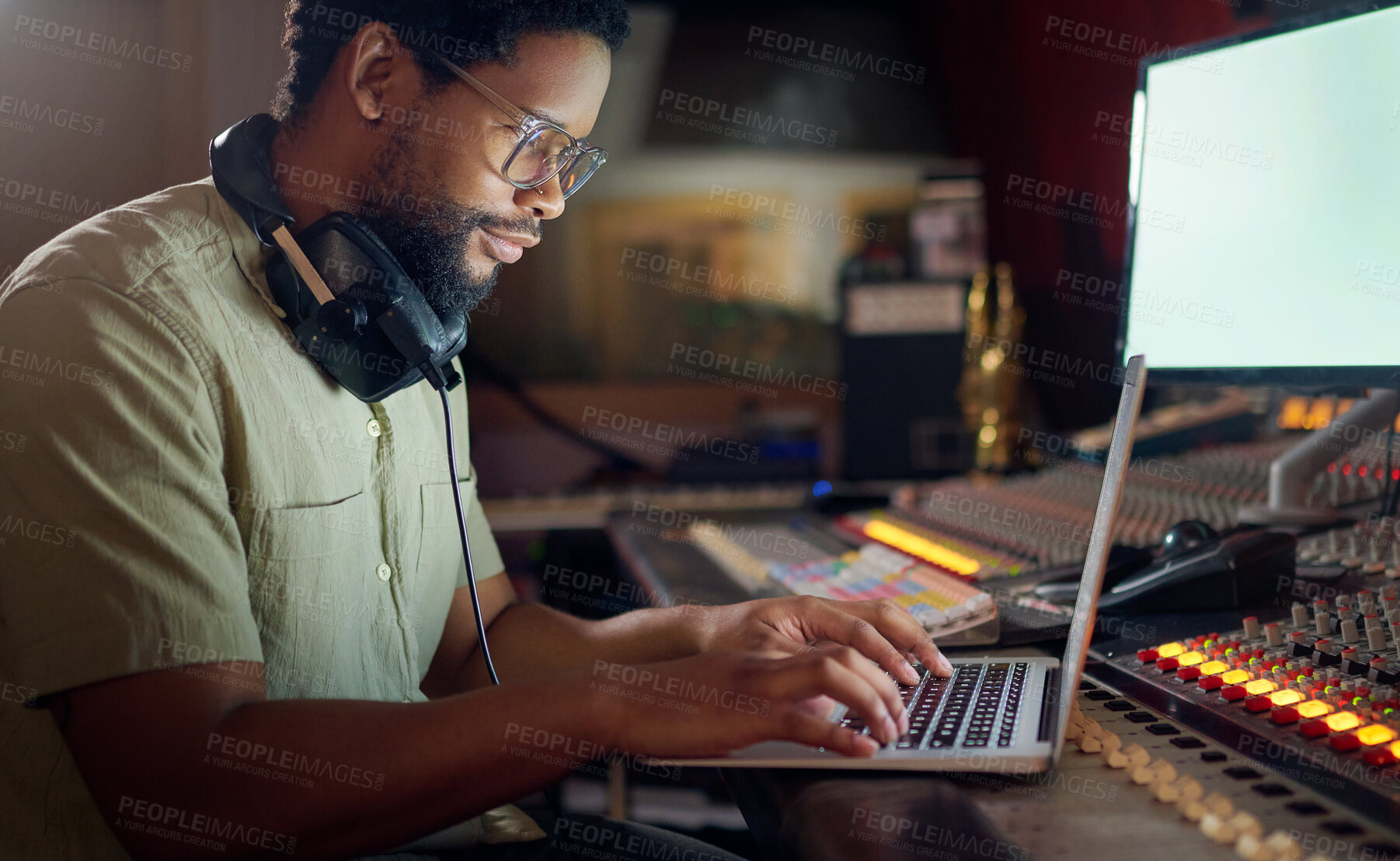 Buy stock photo Black man, thinking and laptop for music recording, sound engineering or song composition in studio. Producer, DJ and musician on technology with ideas for live streaming radio, audio or media album