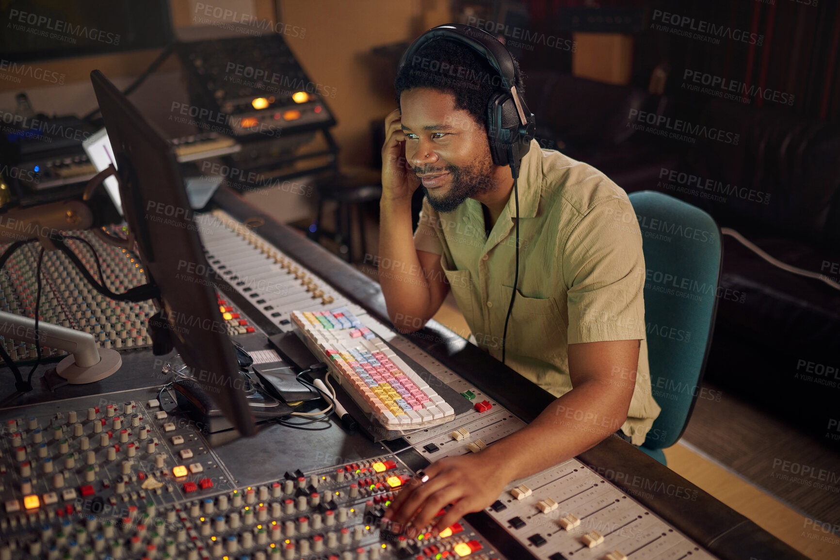 Buy stock photo Computer, music and male producer in studio working on a album, song or audio with tech equipment. Happy, smile and black man radio presenter playing a playlist with technology in creative workplace.