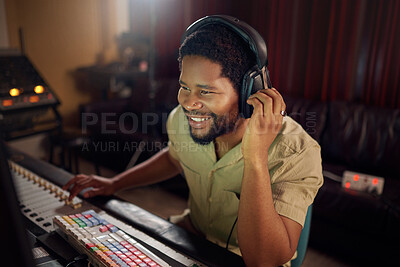 Buy stock photo Headphones, recording studio and man music producer working a album, song or audio with equipment. Happy, smile and African male radio presenter playing playlist with technology in creative workplace