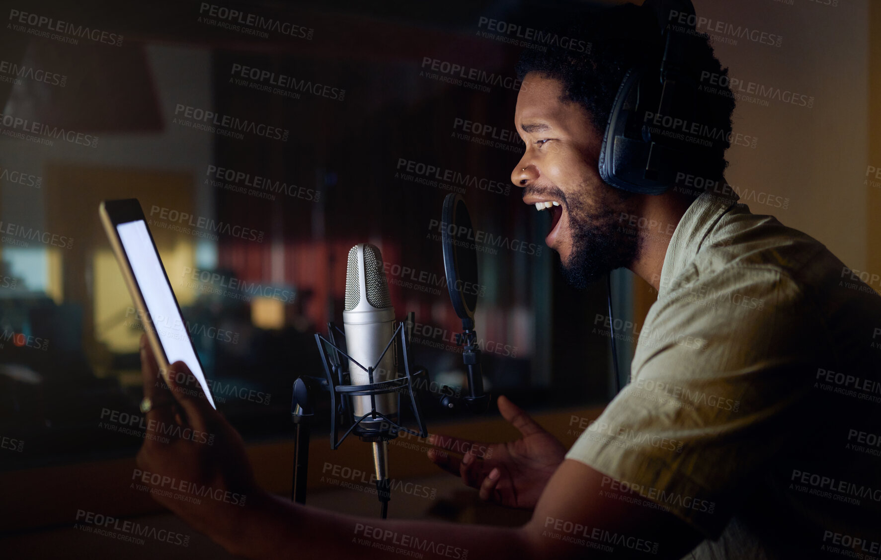 Buy stock photo Tablet, singing or black man on studio microphone, mockup music or mock up lyrics in dark recording. Singer, musician or artist on technology production app, voice media or sound performance practice