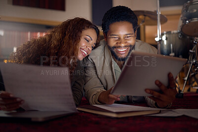 Buy stock photo Streaming music, musician and couple with a tablet for an app, funny video and performance idea in dark. Laughing, creative and artist, song writer or black man and woman with tech for inspiration