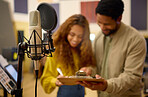 People, clipboard and sign up for podcast, microphone or karaoke in registration at studio event. Man helping woman write time and schedule for live streaming, audition or castings on condenser mic