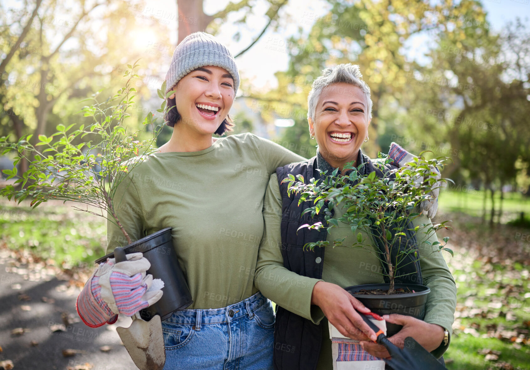 Buy stock photo Portrait, flowers and women volunteering in park for community, outreach or programme together. Environment, charity and friends volunteer in forest for gardening project, happy and smile in nature 