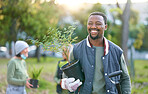Agriculture, nature and black man with a plant in a park after doing sustainable gardening. Happy, smile and eco friendly African male gardener standing with greenery on outdoor field in countryside.