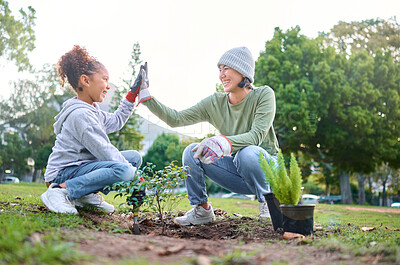 Buy stock photo High five, child and woman with plant for gardening, ecology and agriculture in a park with trees. Volunteer family celebrate growth, nature and sustainability for community environment on Earth day