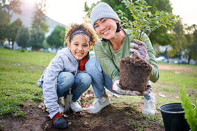 Buy stock photo Family portrait, plant and gardening in a park with trees in nature environment, agriculture or garden. Happy volunteer woman and child planting for growth, ecology and sustainability of community
