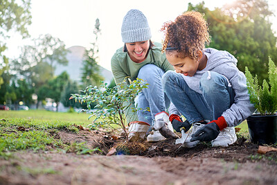 Buy stock photo Volunteer, child and woman with plant for gardening in park with trees in nature environment. Happy family team helping and planting for growth, ecology and sustainability for community on Earth day