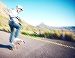 Blurred, fast and man skateboarding in the street for fitness, training and exercise in Brazil. Sport, speed and person doing tricks on a skateboard in the road for urban action, movement and balance