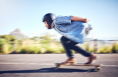 Buy stock photo Skateboard, sports man and skating fast on road for fitness, exercise or wellness. Training, freedom and travel adventure of skater person moving with speed, balance and safety outdoor on asphalt