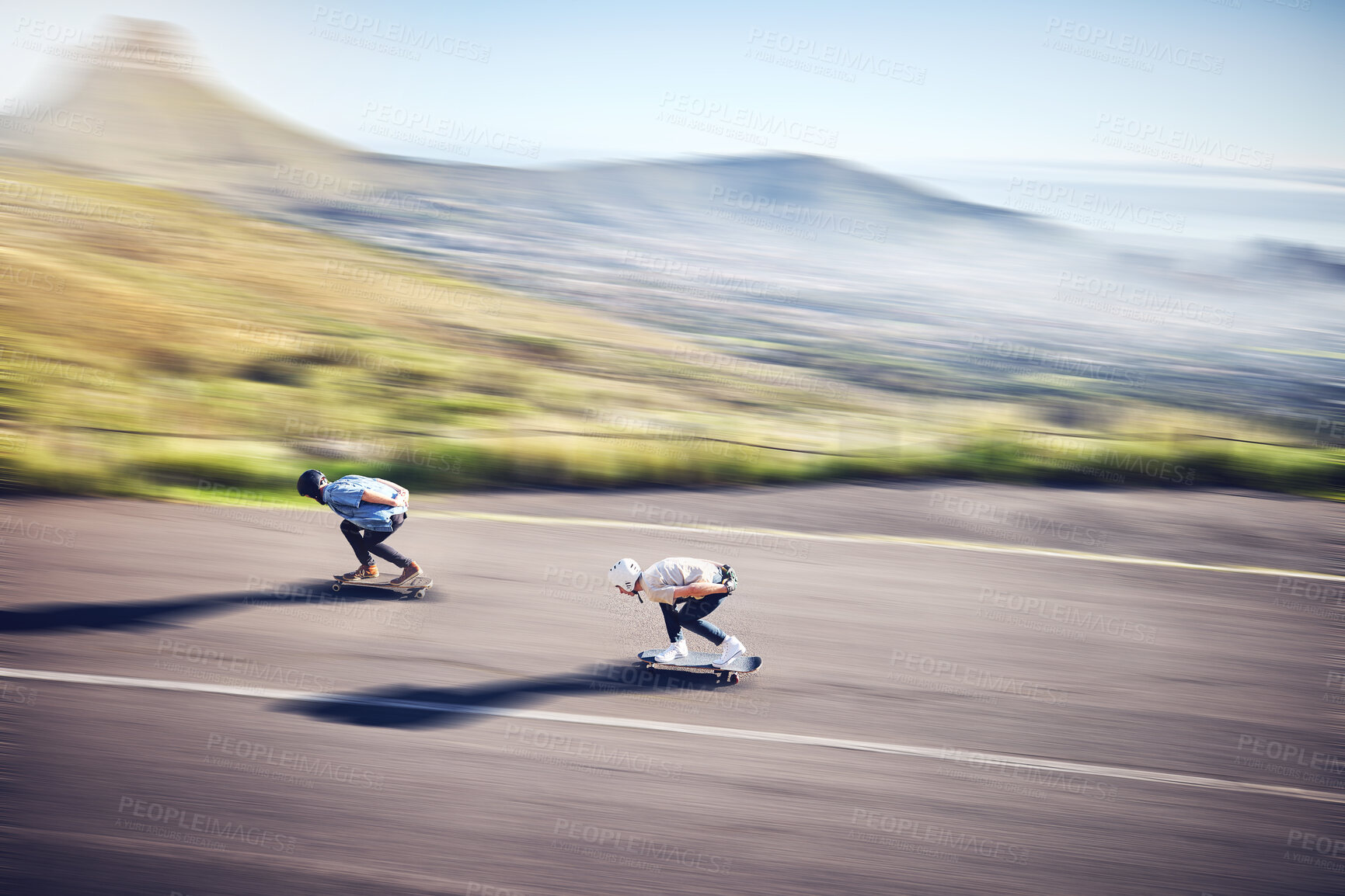 Buy stock photo Skateboard, fast and road with people training, competition or danger, risk and adventure sports from above. Speed, motion and moving skater team on a street for youth energy, performance and action