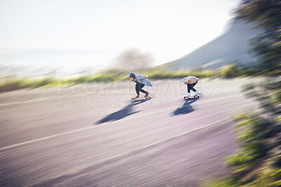 Skateboard, fast and people on road training, competition or danger, risk and adventure sports, above. Speed, blurred background and skater team moving on street for youth energy, balance and action