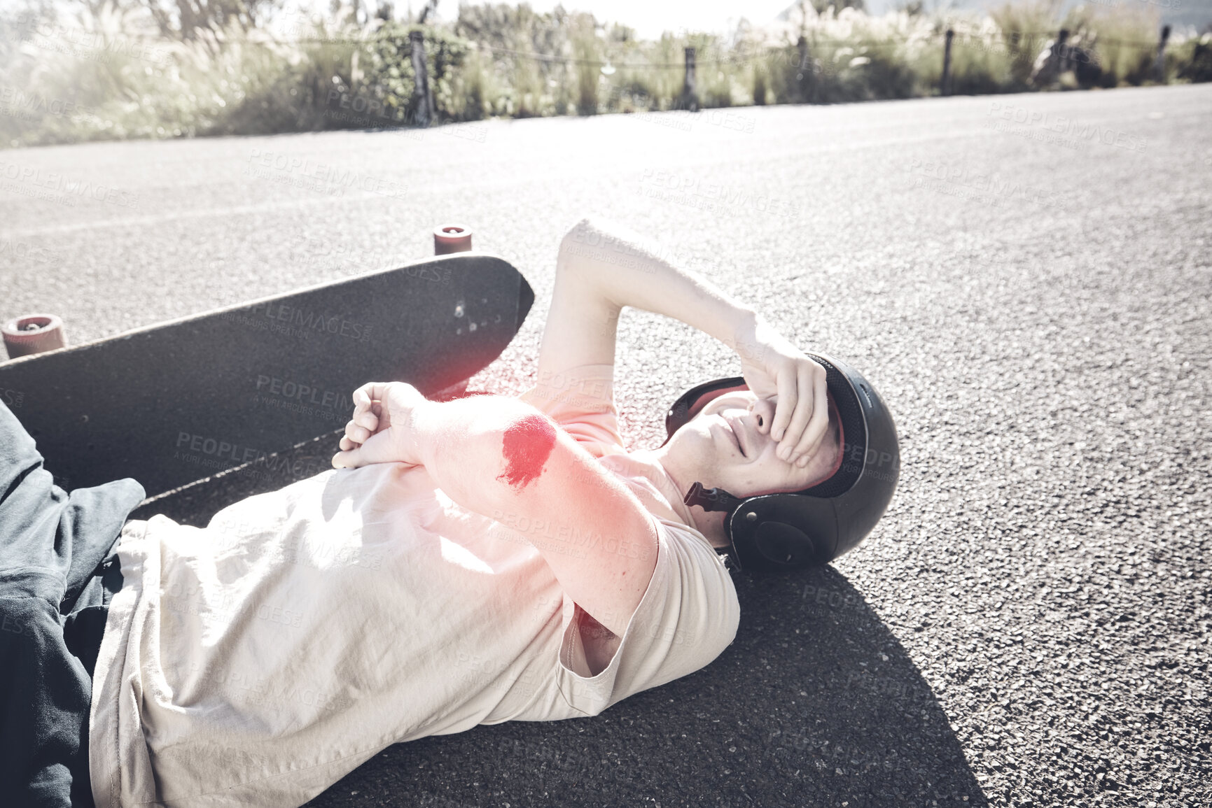 Buy stock photo Pain, skateboarder and man with arm injury on road after fall, accident or exercise workout outdoors. Sports emergency, skating and crying male with bleeding elbow, painful wound and broken bones.