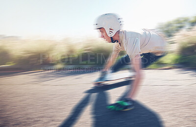 Skate, blurred motion and speed with a sports man skating on an asphalt road outdoor for recreation. Skateboard, soft focus and fast with a male athlete or skater training outside on the street