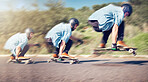 Skateboard, sports and man with speed in action on road ready for adventure, freedom and exercise on mountain. Friendship, skateboarding and male skater with longboard for motion, skating and fitness