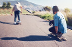 Sports, skateboard and friends with speed in action on road ready for adventure, freedom and motion blur. Friendship, skateboarding and skaters with longboard for exercise hobby, skating and fitness