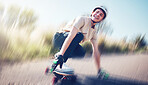 Skateboard, blurred motion and fast with a sports man skating on an asphalt road outdoor for recreation. Skate, soft focus and speed with a male athlete or skater training outside on the street