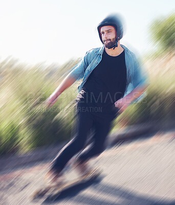 Motion blur, skateboard and balance with a sports man training outdoor on an asphalt street at speed. Skating, speed and movement with a male skater on a road for fun, freedom or training outside