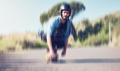 Skater, motion blur and speed with a sports man skating on an asphalt road outdoor for recreation. Skate, soft focus and fast with a male athlete on a skateboard training outside on the street