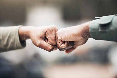 Buy stock photo People, hands and fist bump for agreement, deal or trust in partnership, unity or support on a blurred background. Hand of team touching fists for community, teamwork or collaboration in the outdoors