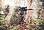 Paintball gun, woods and man with aim by trees for outdoor war game, shooting strategy or spy in natural camouflage. Shooter, sniper or running for safety with eyes on target in military battle games