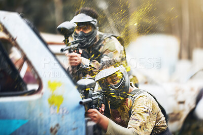 Buy stock photo Paintball, shooting and people in action competition, game or match as a competitive team on a battleground. Aim, gun and player or teamwork of group in extreme sports with camouflage and safety mask