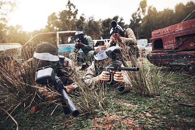 Buy stock photo Paintball, camouflage and team playing a match for fun, fitness and extreme sports with guns. Army, weapons and group of military people practicing or training for a game on an outdoor battlefield.