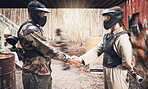 Handshake, paintball team and congratulations or support, sports game on battlefield and partnership with agreement. Mask for safety, speed and gun, people together on shooting range with trust