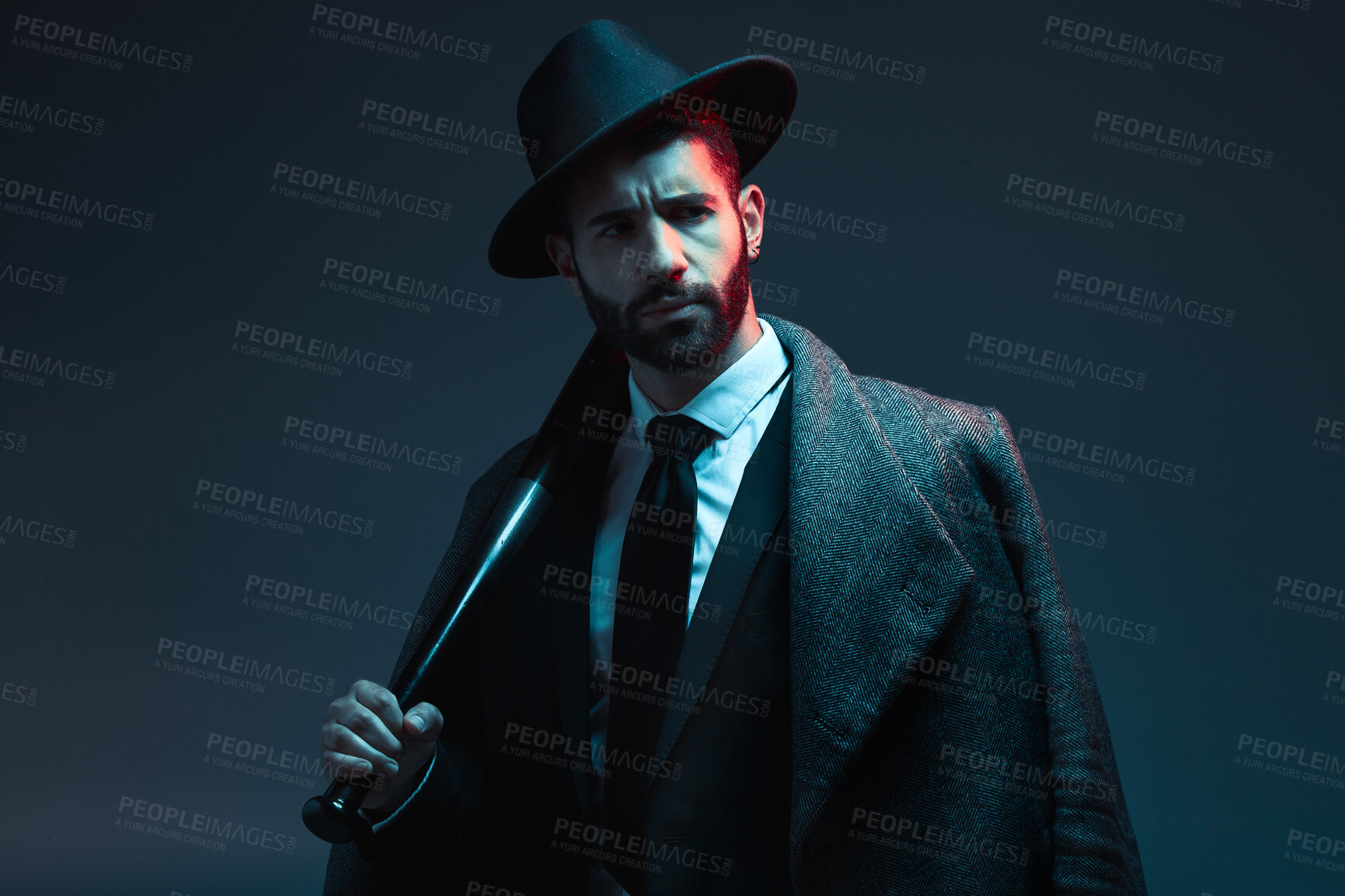 Buy stock photo Fashion, criminal and face of man with bat for vintage, retro and Victorian gangster on dark background. Crime aesthetic, thinking and male model with luxury, designer suit and threatening attitude