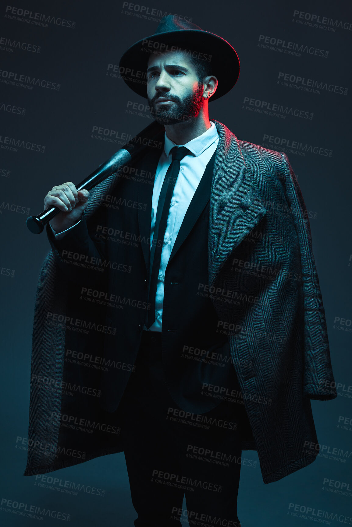 Buy stock photo Fashion, criminal and man in studio with bat for vintage, retro and Victorian gangster on dark background. Crime aesthetic, thinking and male model with luxury clothes, designer and elegant suit