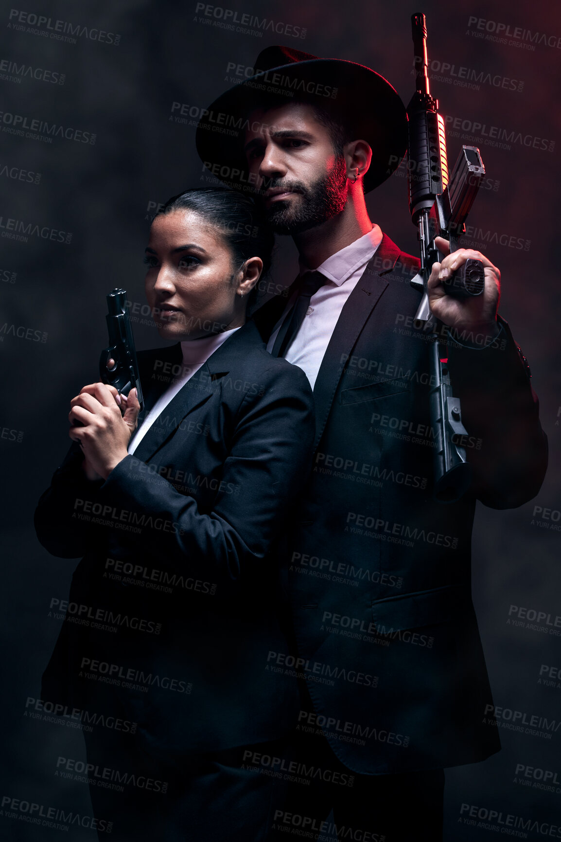 Buy stock photo Gangster couple, fashion or gun on studio background in secret spy, isolated mafia safety or crime lord security. Man, love or model woman with pistol in stylish, trendy or fashion clothes aesthetic