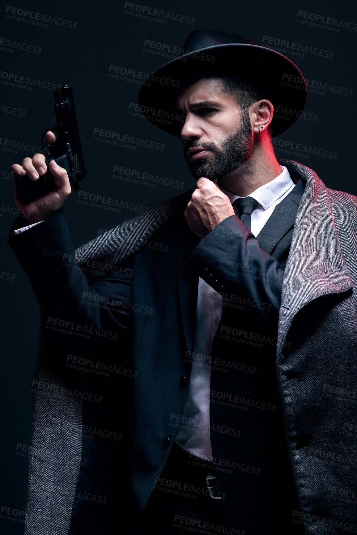 Buy stock photo Gangster, leadership or holding gun on studio background in dark secret spy, isolated mafia or crime lord security. Model, man and hitman suit with weapon in formal style or fashion clothes aesthetic