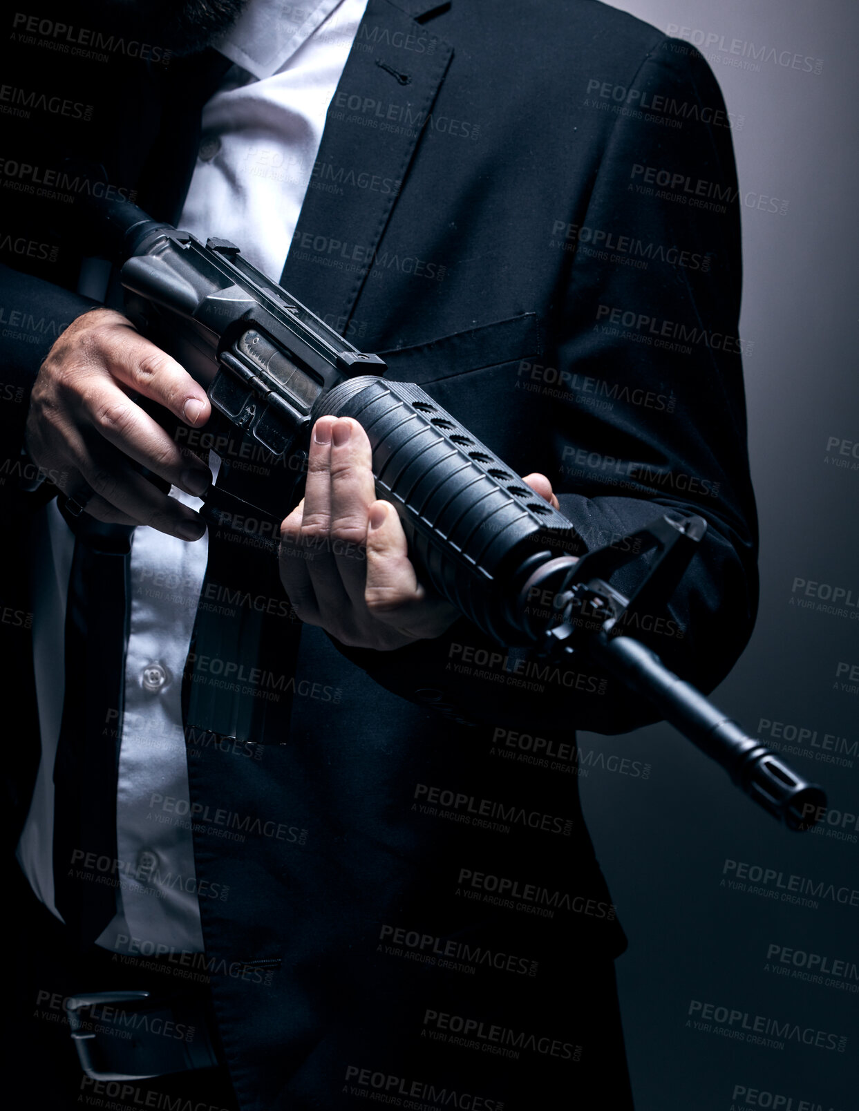 Buy stock photo Gangster, hands or holding gun on studio background in dark secret spy, isolated mafia leadership or crime lord security. Model, man or hitman weapon in suit, fashion clothes or bodyguard aesthetic