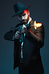 Man, suit or shooting gun on dark studio background in secret spy, isolated mafia leadership or crime lord security. Model, gangster or hitman firing gun in style, formal or fashion clothes aesthetic