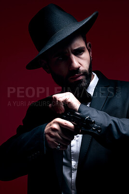 Mafia, fashion and mystery man in a suit isolated on a dark