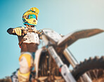 Motorbike, sports gear and man on blue sky mockup for challenge, race and rally. Driver, bike and ready for motorcross competition, performance and action of fearless adventure, power and start show