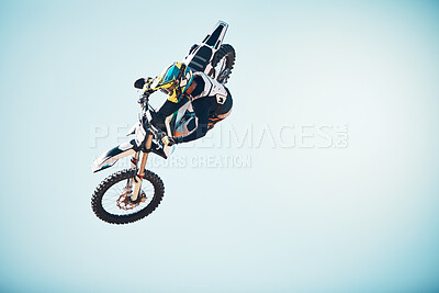 Buy stock photo Motorbike, outdoor jump and man on blue sky mockup for speed challenge, sports risk and fearless skill. Driver, air stunt and biker with energy, freedom and performance talent of motorcycle adventure