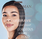 Portrait of one beautiful young hispanic woman with healthy skin and sleek hair posing against a blue studio background. Mixed race model with flawless complexion and natural beauty